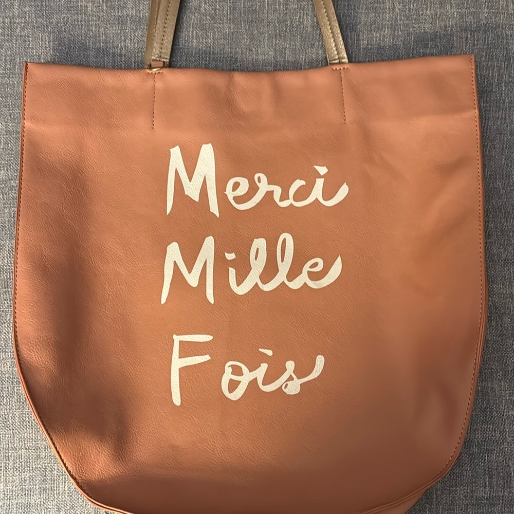 Brand new with tags Anthropologie “merci Mille fois” oversized bag.